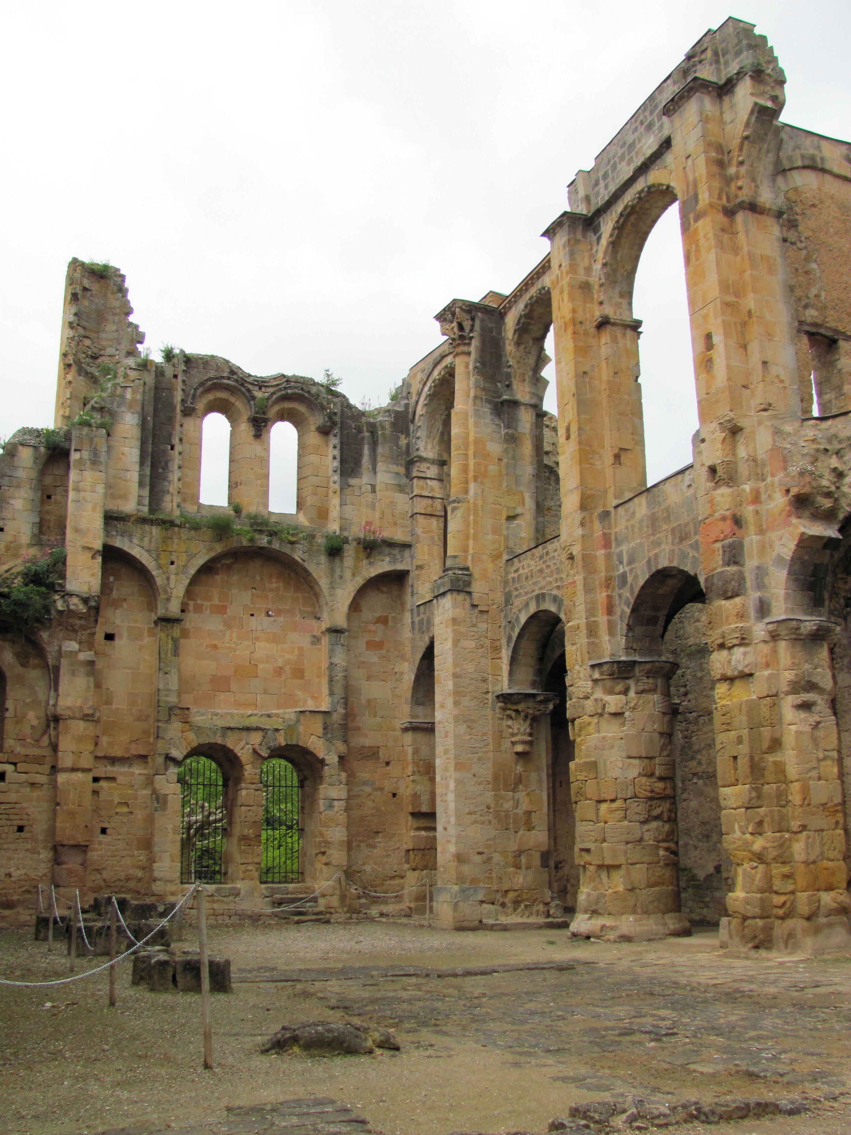 Ancient stone ruins with arches and columns.