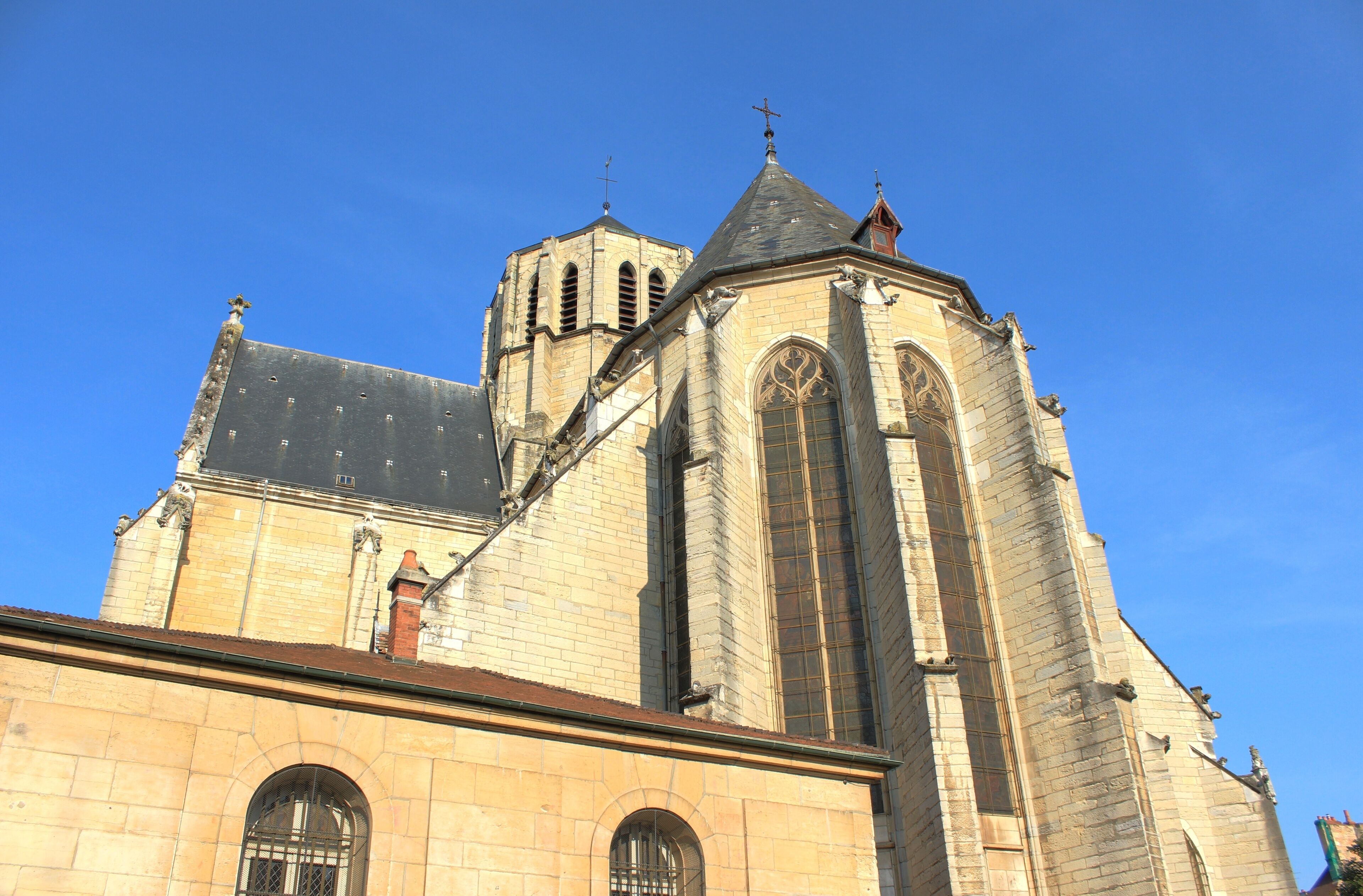 A historic church with a prominent bell tower and arched windows.