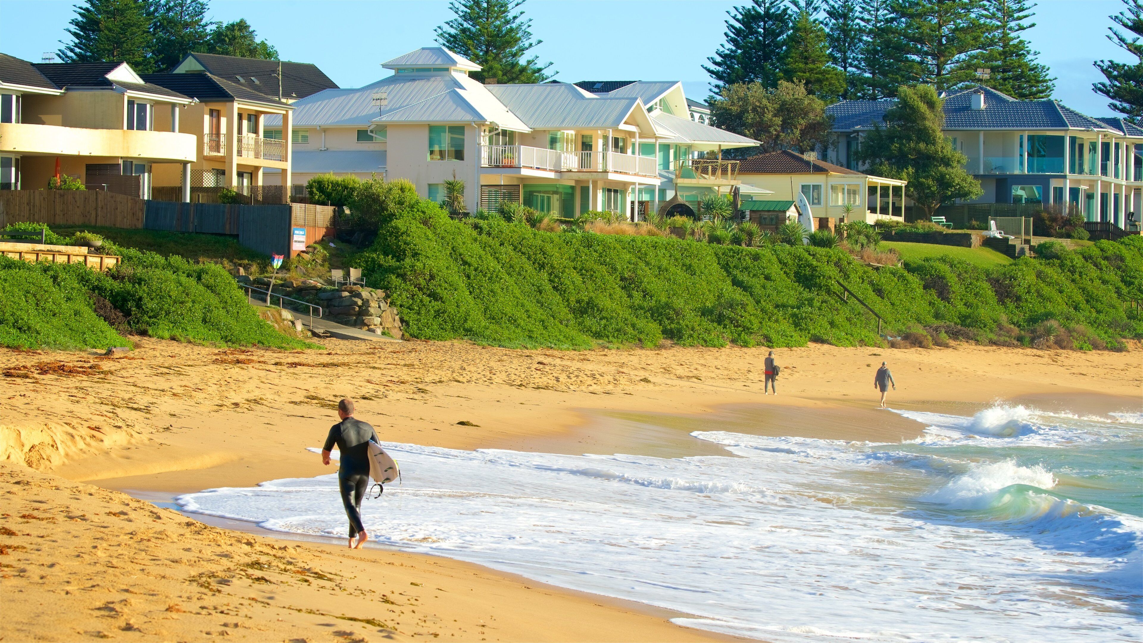 Blue Bay featuring a coastal town, a beach and a bay or harbor