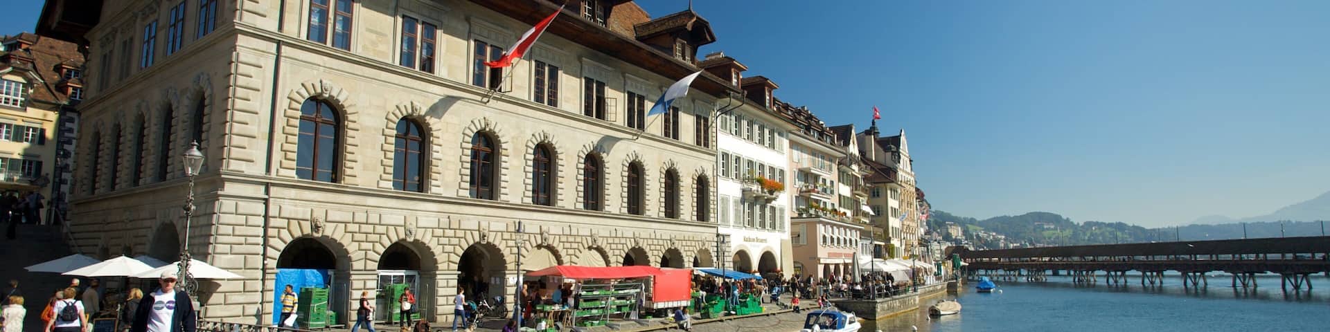 Old Town Lucerne featuring a river or creek, a bridge and a coastal town