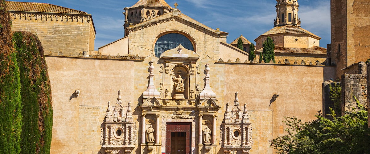 A historic church with ornate architecture, a large central dome, and a bell tower.