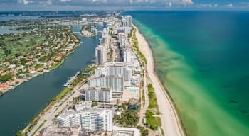 Aerial Miami Beach along Collins Avenue mid beach waterway with Yacht Marina and high rise condos