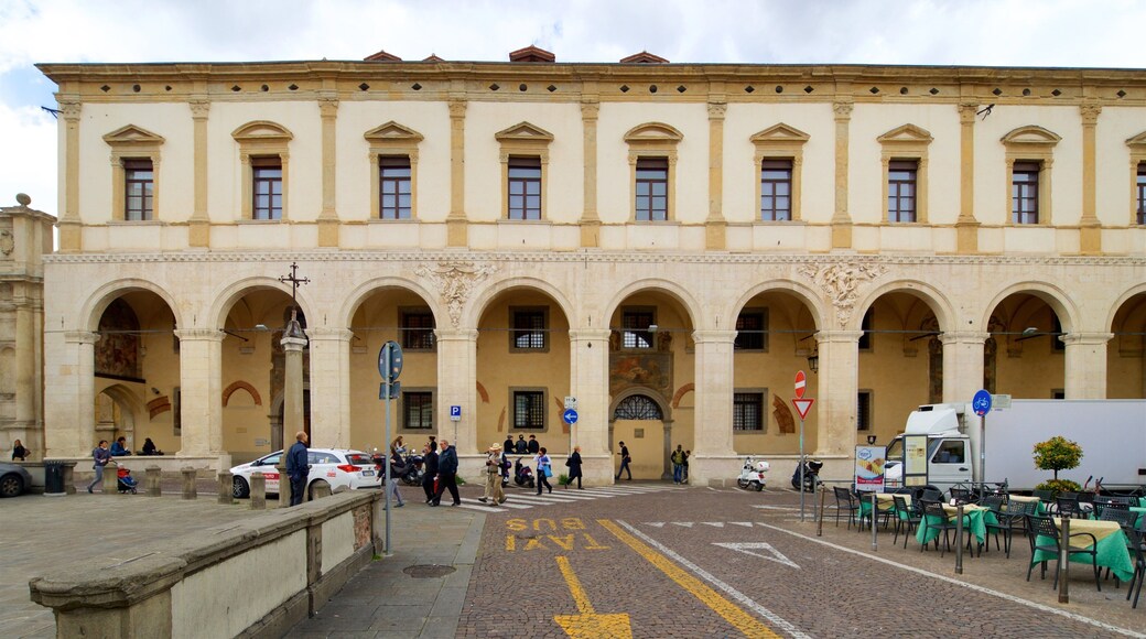 Piazza del Duomo featuring street scenes and heritage elements as well as a small group of people