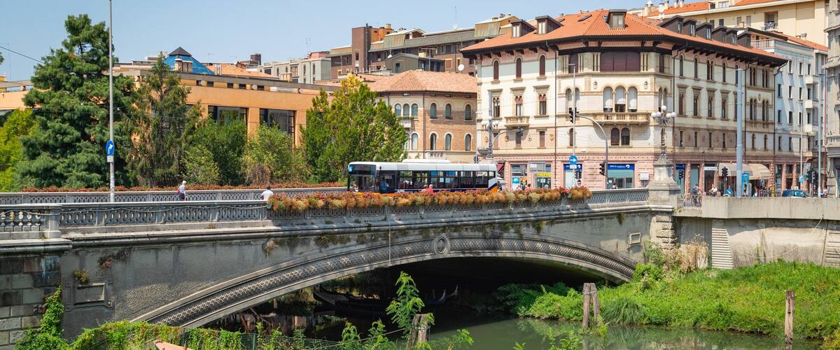 Giardini dell\'Arena featuring a river or creek and a bridge