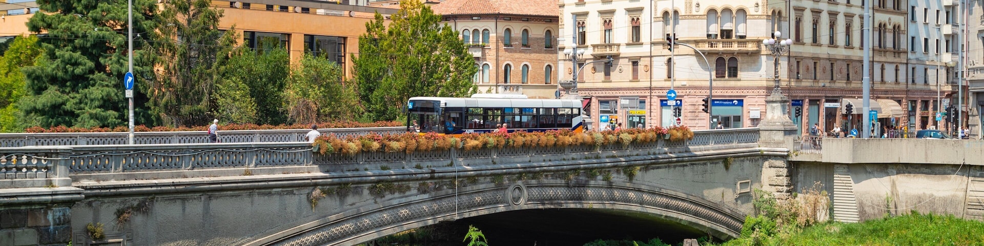 Giardini dell\'Arena featuring a river or creek and a bridge