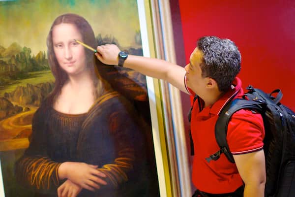 Art in Paradise featuring interior views and art as well as an individual male