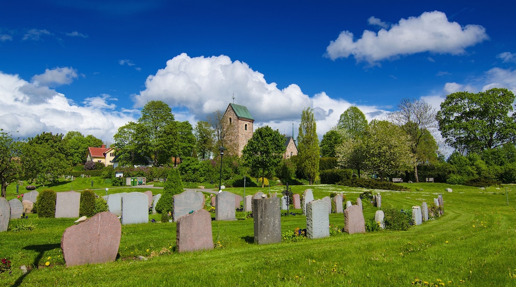 Old sweden church with cemetery in small town near Stockholm - Vallentuna, spring vivid natural outdoor Sweden background