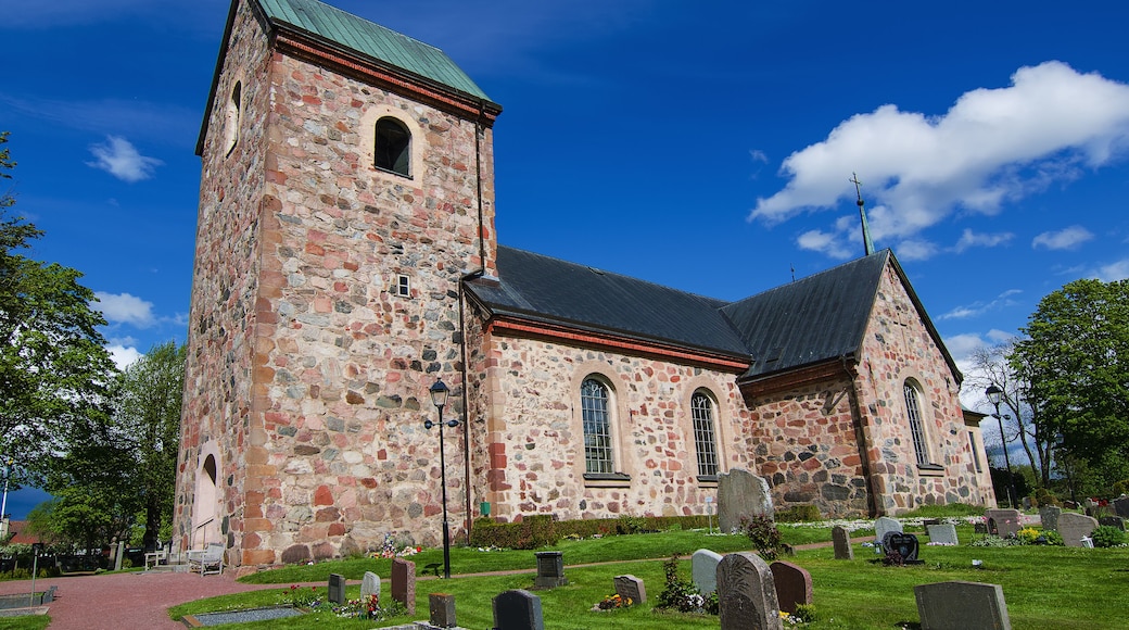 Old sweden church with cemetery in small town near Stockholm - Vallentuna, vivid natural outdoor Sweden background