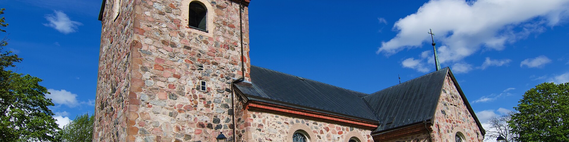Old sweden church with cemetery in small town near Stockholm - Vallentuna, vivid natural outdoor Sweden background