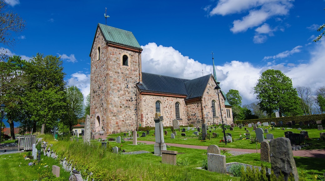 Old sweden church with cemetery in small town near Stockholm - Vallentuna, vivid natural outdoor Sweden background