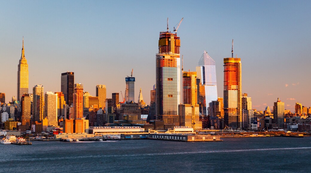 Midtown featuring a bay or harbor, a sunset and a city