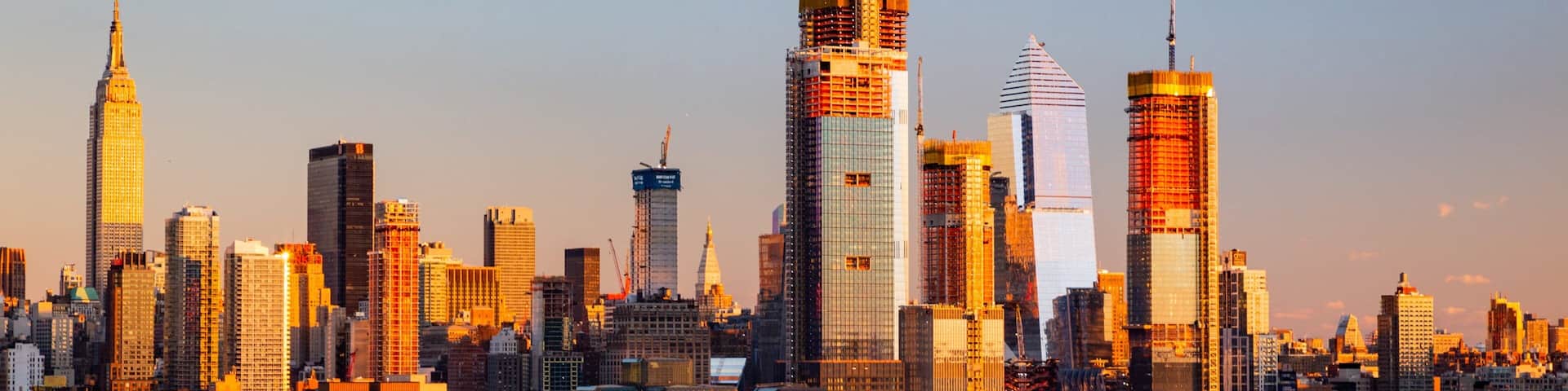 Midtown featuring a bay or harbor, a sunset and a city