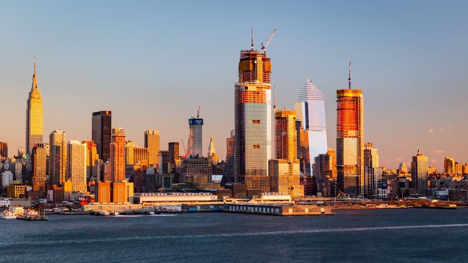 Midtown featuring a bay or harbor, a sunset and a city