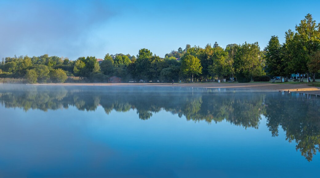 Clairvaux-Les-Lacs, France - 09 02 2020: Fog and reflections on the big lake - La Raillette