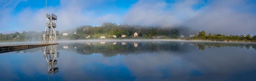 Clairvaux-Les-Lacs, France - 09 02 2020: Fog and reflections on the big lake - La Raillette