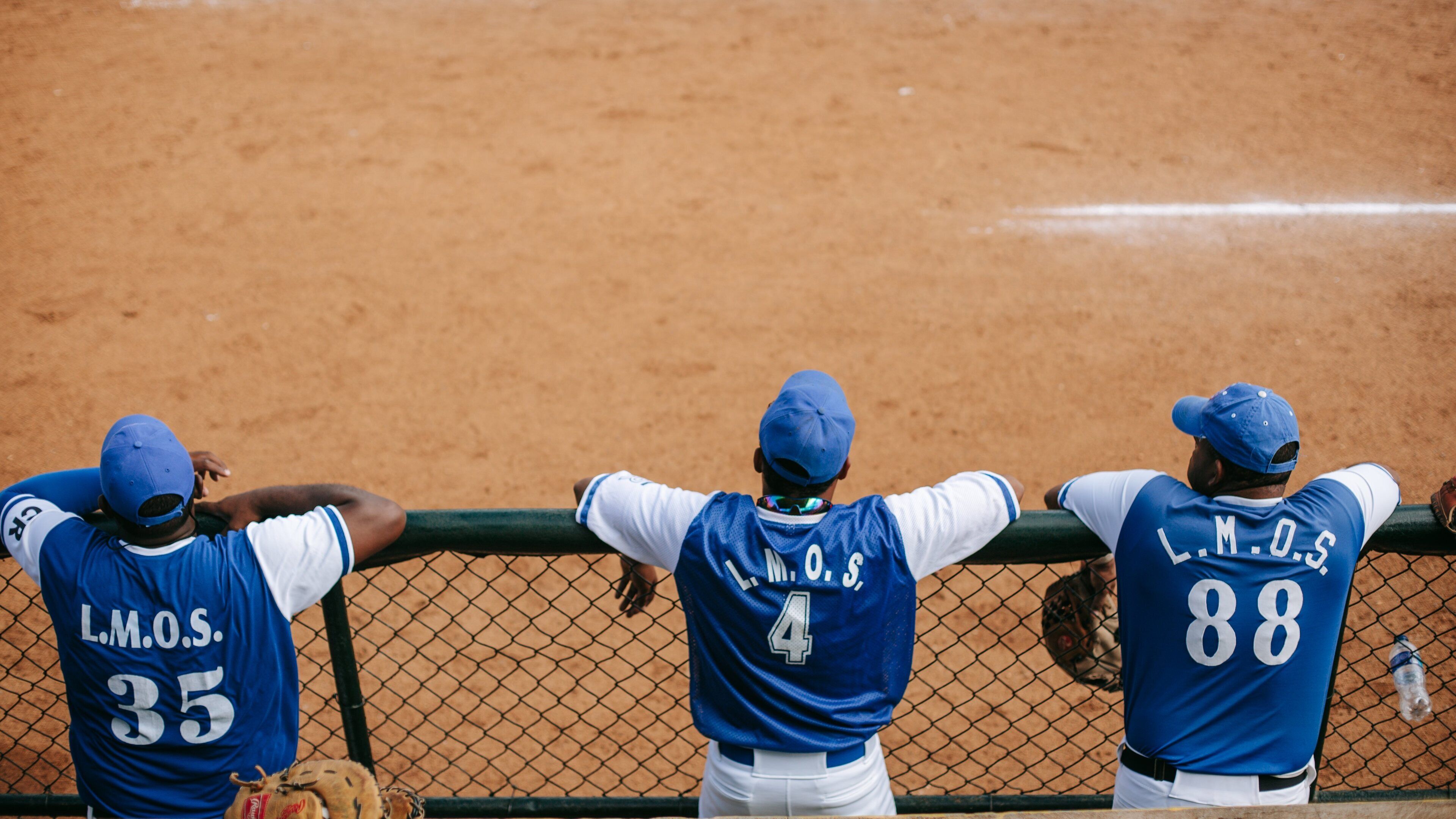 La Romana featuring a sporting event as well as a small group of people