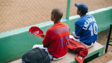 La Romana showing a sporting event as well as a small group of people