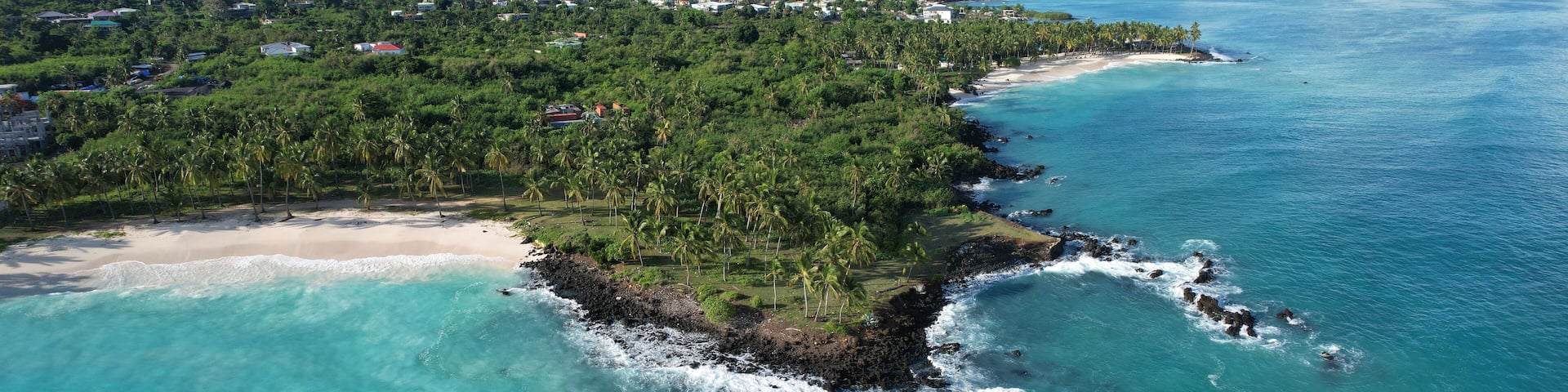 Beach, palm trees and volcanic rocks, Mitsamiouli, Grande Comore, Comoros