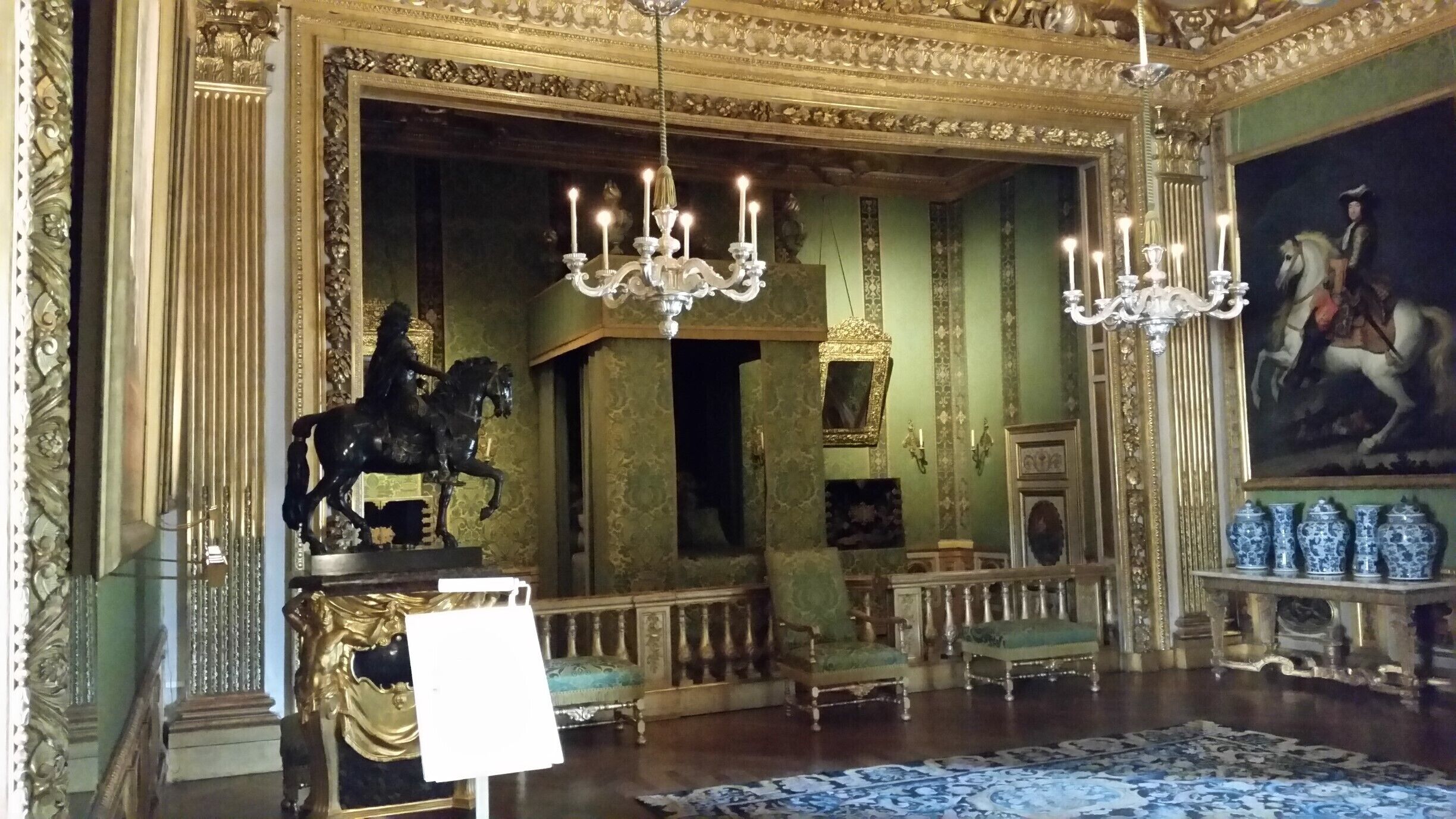 A bedroom. Notice how short the bed is.