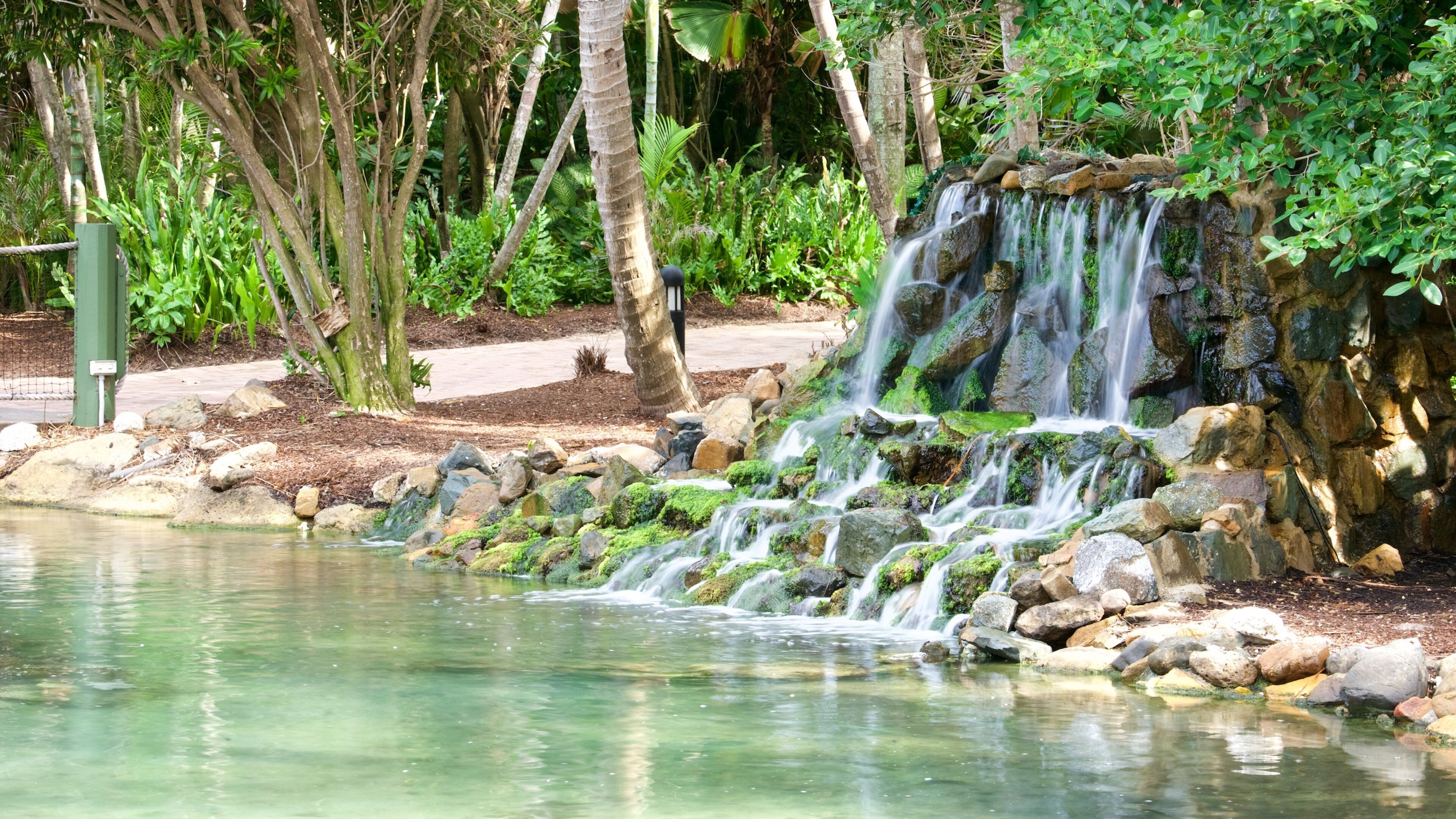 Molle Islands National Park showing a waterfall, a pond and a park
