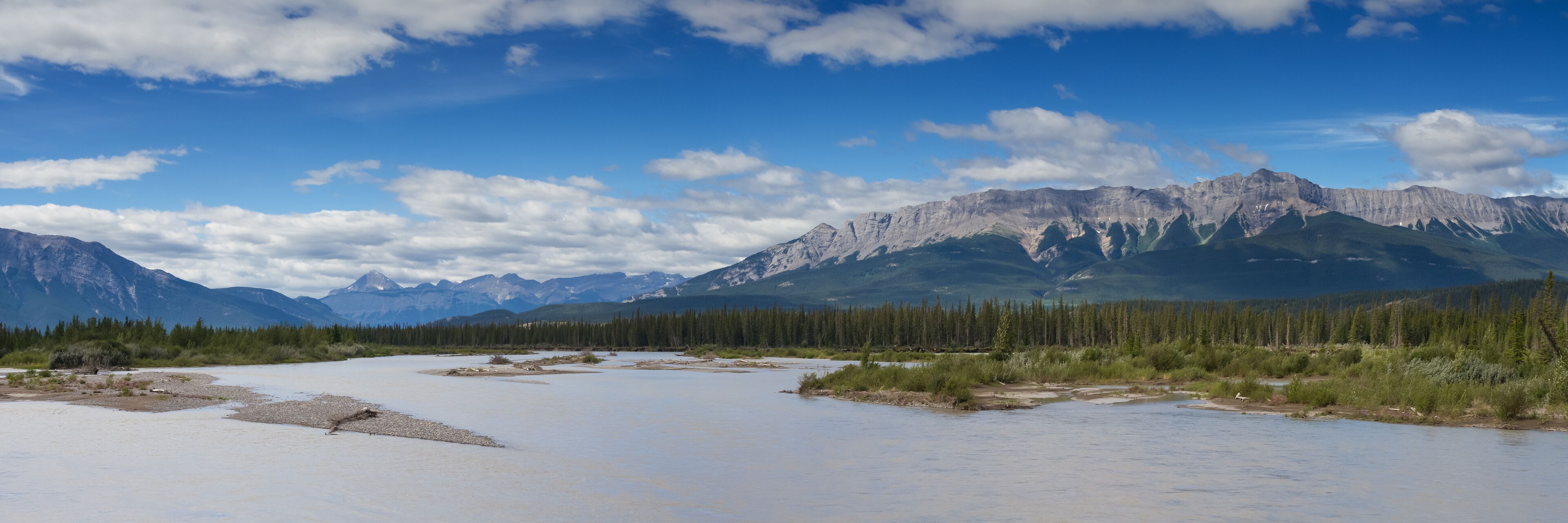 A river with mountains in the background.