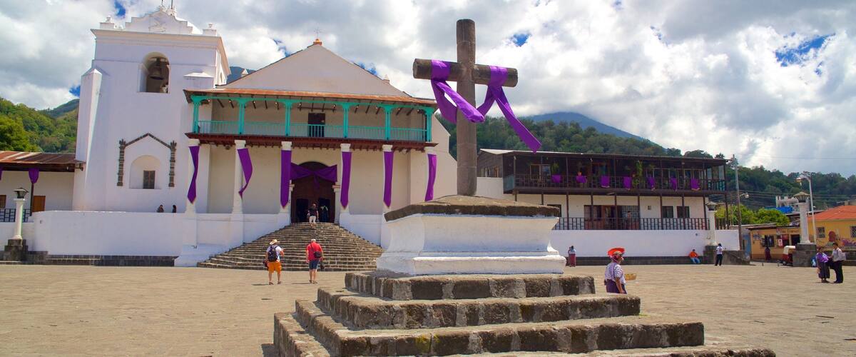 A church with a large cross and steps leading up to it.