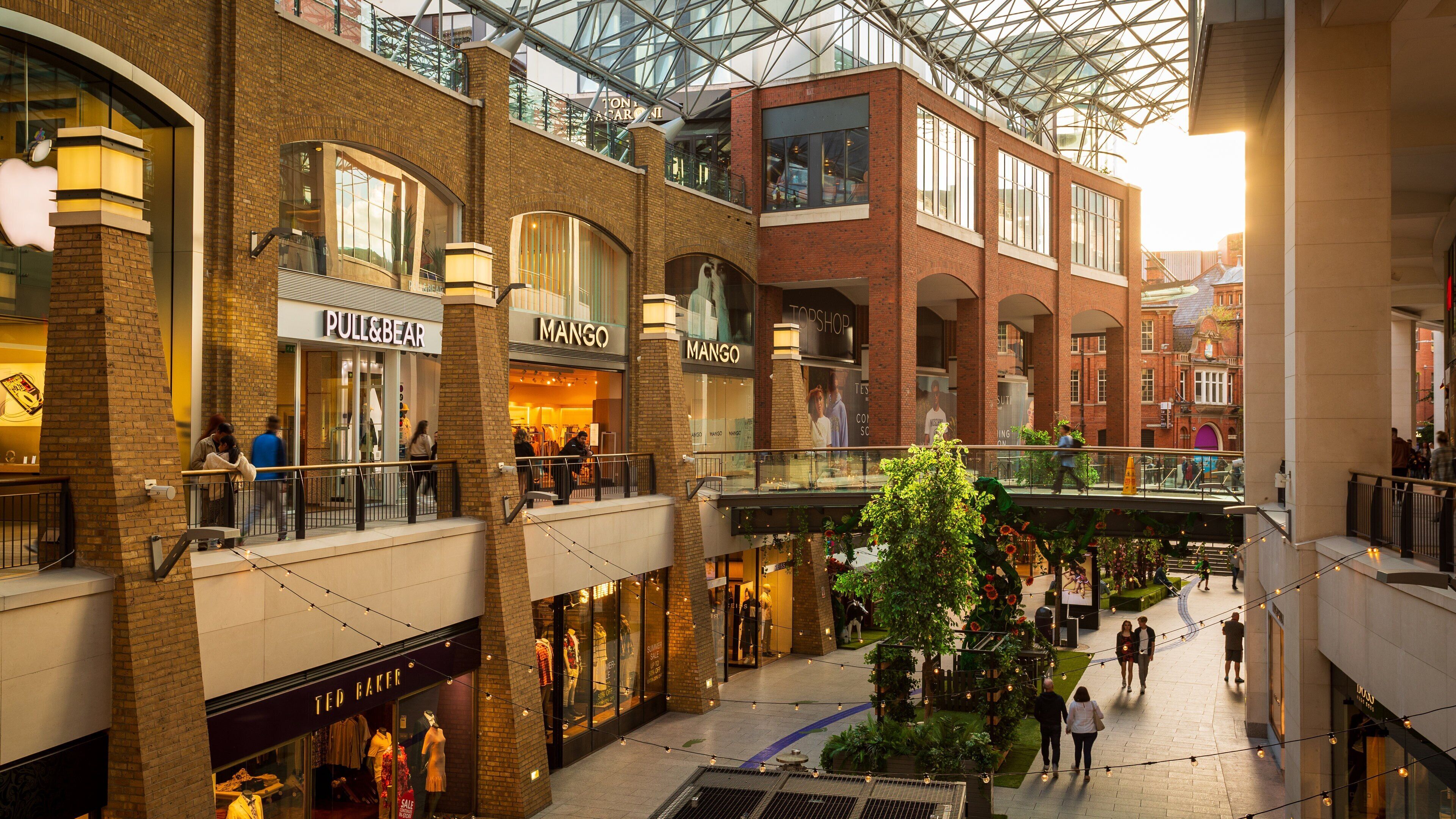 Victoria Square Shopping Centre which includes shopping and a sunset