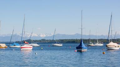 Panorama with anchoring sailboats at Starnberger See.