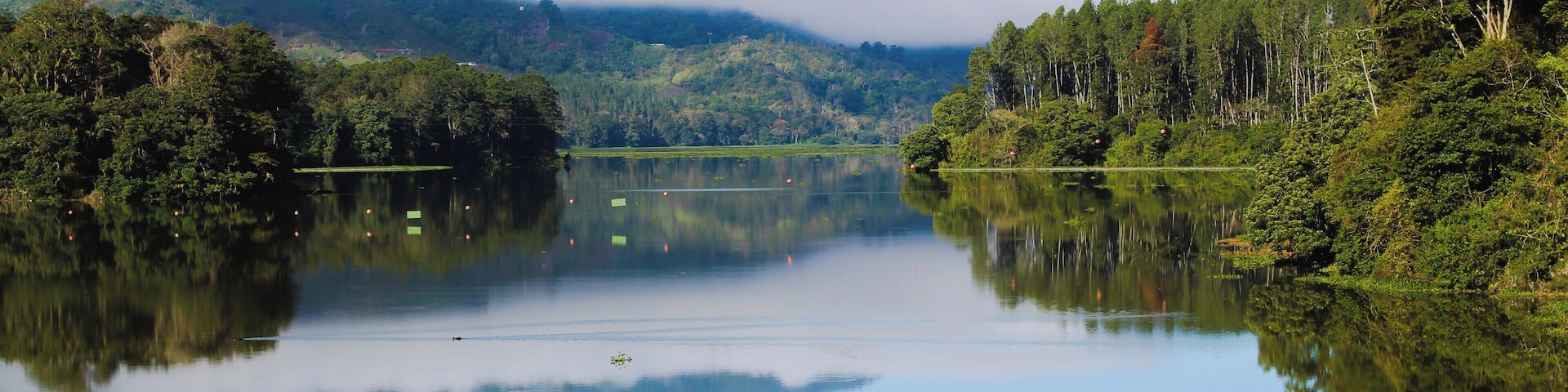 It was really early in the morning and the clouds still were touching the mountains, beautiful lake it was a peaceful experience