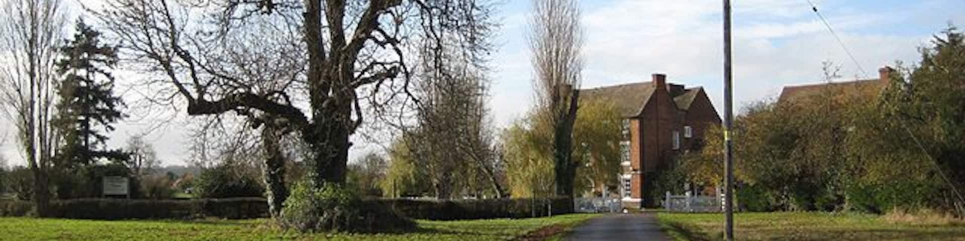 Corse Lawn House Hotel Grade II listed Queen Anne style house set back from the village green.