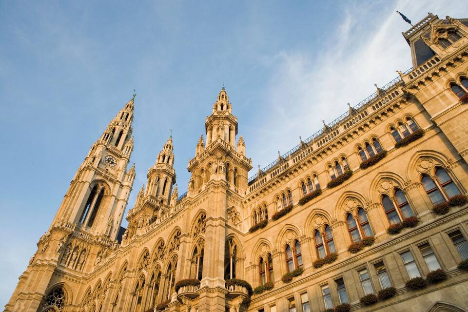 A grand, ornate building with multiple towers and intricate architectural details.