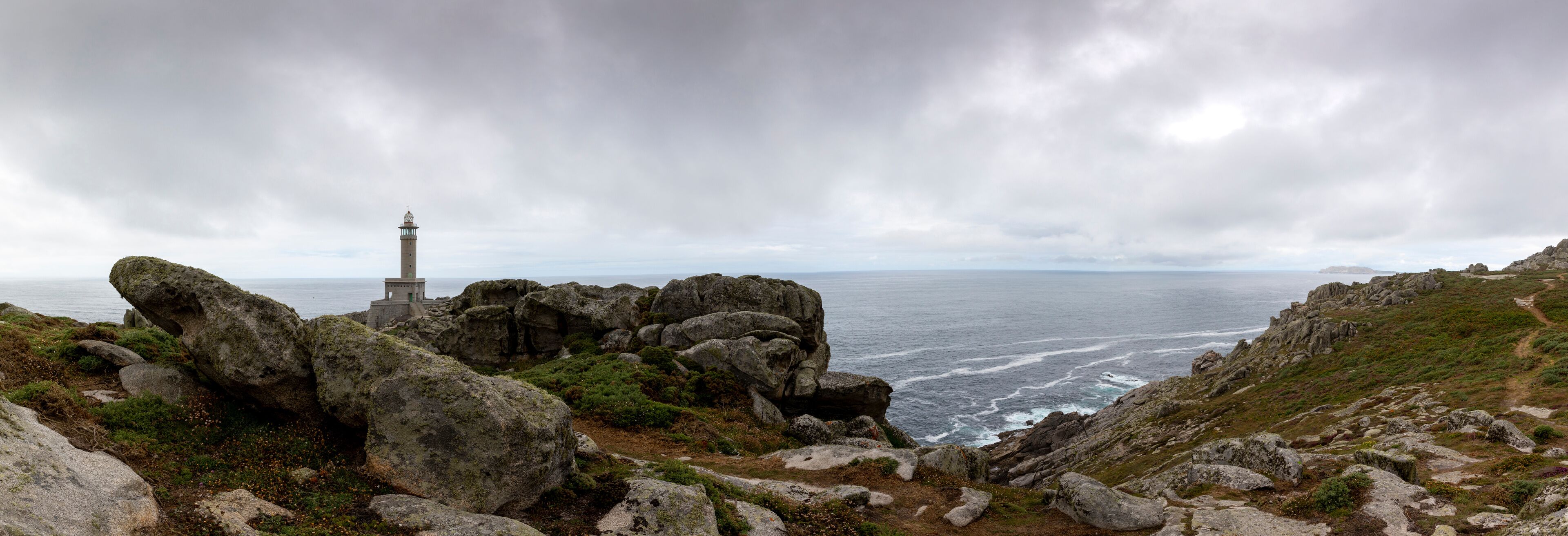 A rocky coastline with a lighthouse.