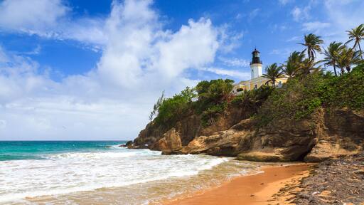 Puerto Rico coastline beach at Punta Tuna lighthouse in summer with a blue sky and clouds