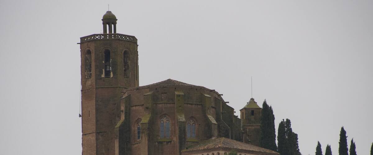 A historic church with a bell tower and a dome.