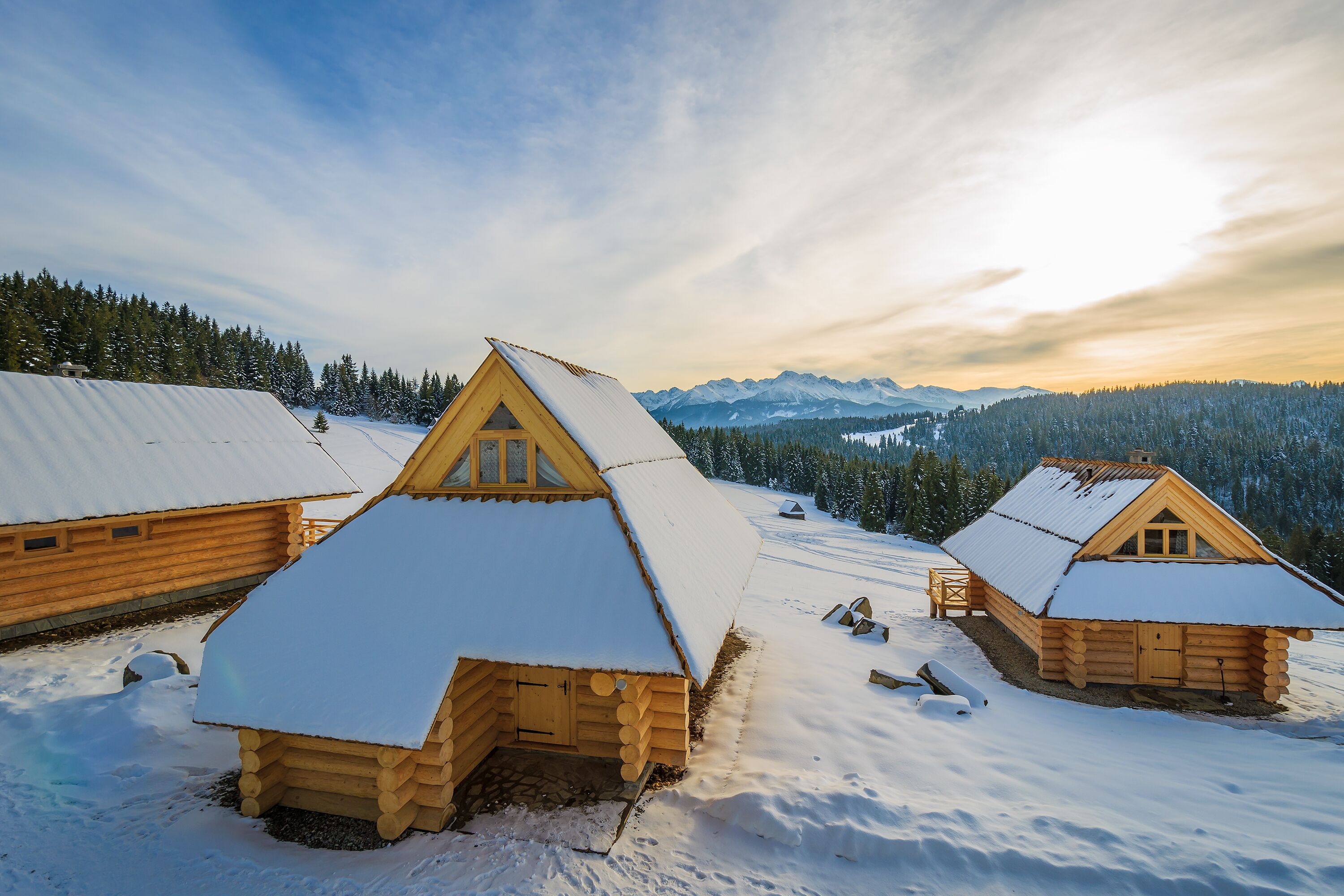 Wooden houses in Bukowina Tatrzanska in winter landscape of Tatra Mountains, Poland; Shutterstock ID 249308827