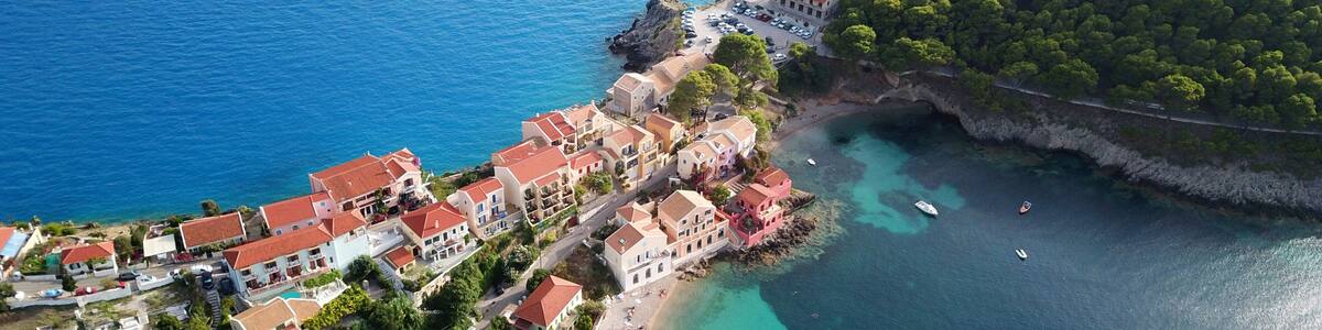 Aerial drone bird's eye view photo of beautiful and picturesque colorful traditional fishing village of Assos in island of Cefalonia, Ionian, Greece