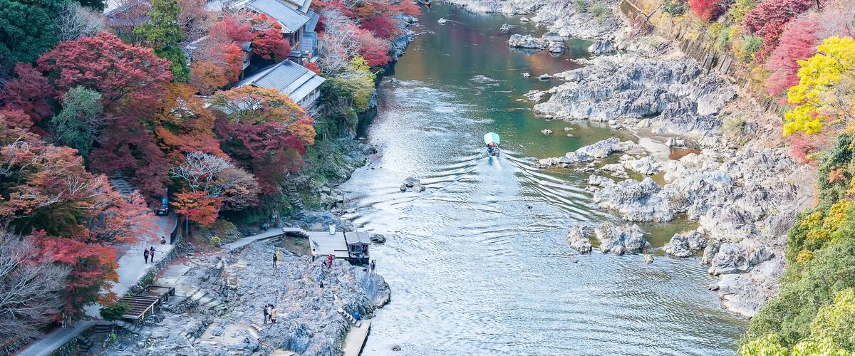 colorful leaves mountains and Katsura river in Arashiyama, landscape landmark and popular for tourists attractions in Kyoto, Japan. Fall Autumn season, Vacation,holiday and Sightseeing concept