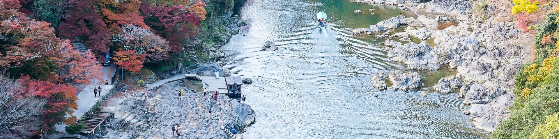 colorful leaves mountains and Katsura river in Arashiyama, landscape landmark and popular for tourists attractions in Kyoto, Japan. Fall Autumn season, Vacation,holiday and Sightseeing concept