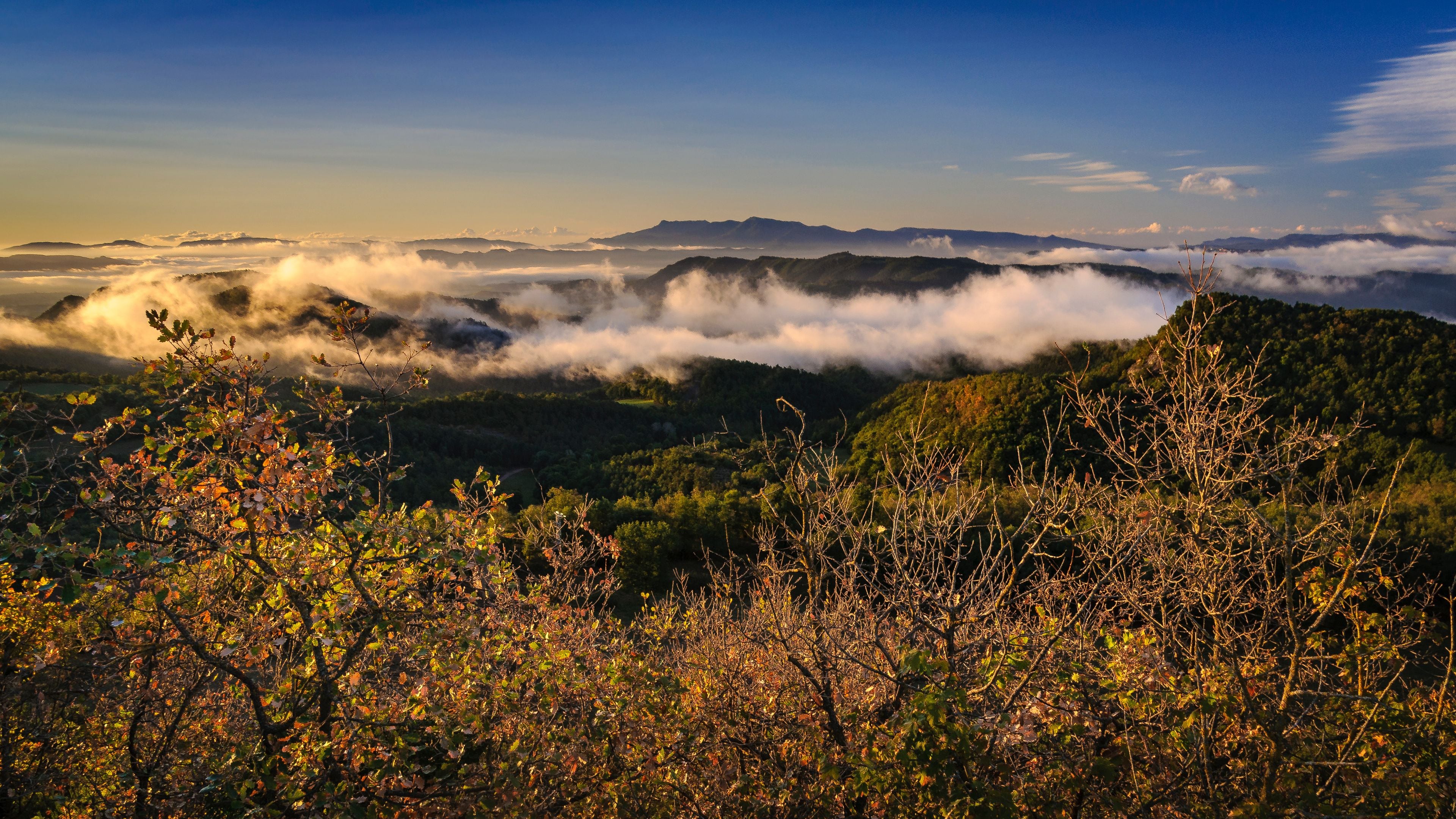 Autumnal sunrise seen from the Santuari dels Munts viewpoint in Lluçanès (Osona, Barcelona, Catalonia, Spain)