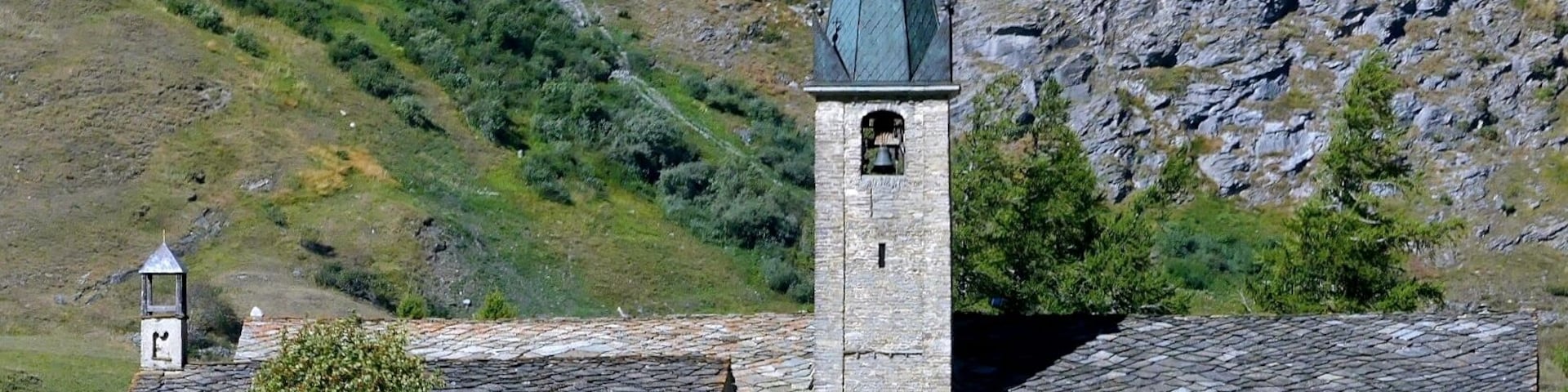 Sight, in summer, of Saint-Jean-Baptiste church of Bessans in the high Maurienne valley, in Savoie, France.
