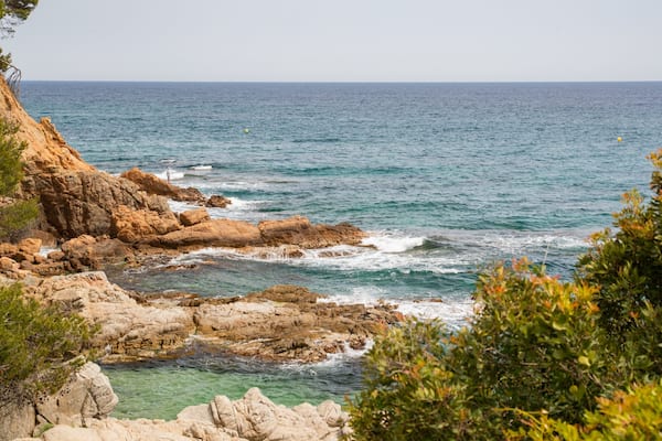 Cala Boadella Beach featuring rocky coastline and general coastal views
