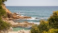 Cala Boadella Beach featuring rocky coastline and general coastal views