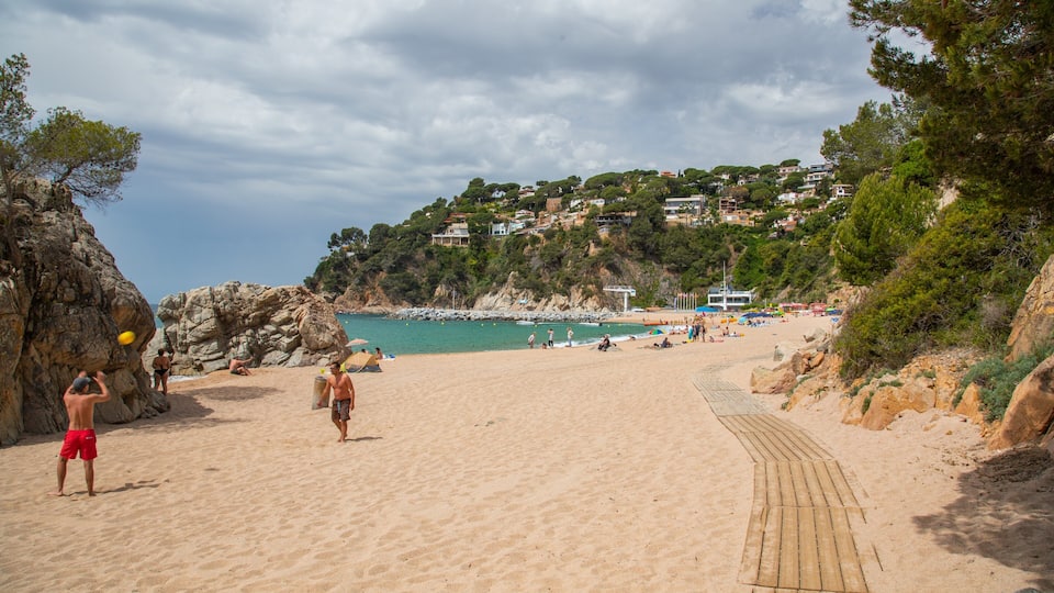 Cala Canyelles Beach which includes a sandy beach and general coastal views