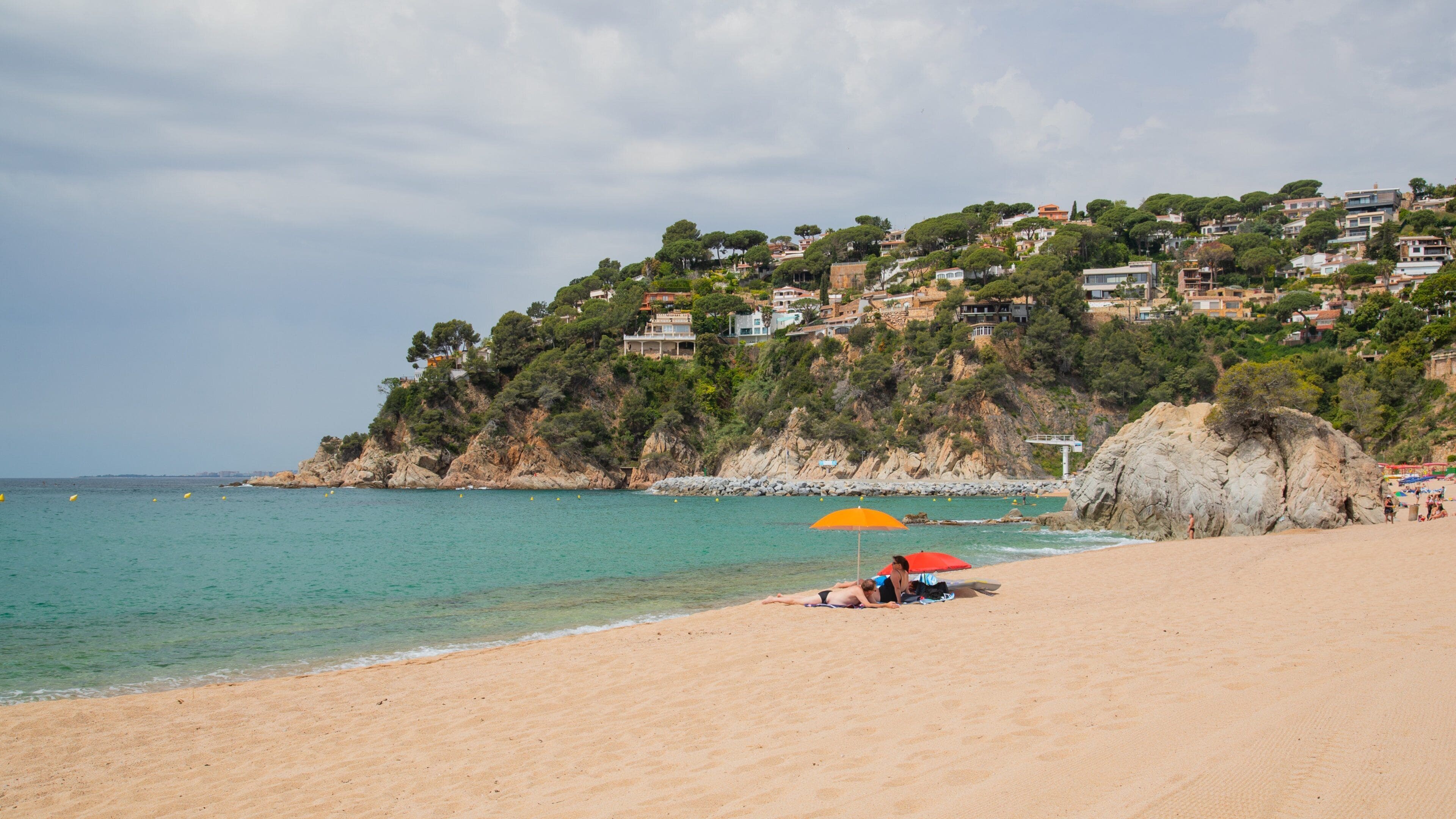 Cala Canyelles Beach featuring a beach, general coastal views and a coastal town