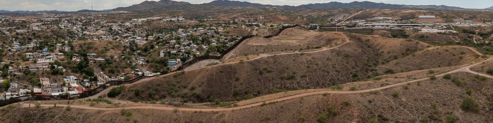Aerial view of US Mexico Border fence in Nogales, Arizona.