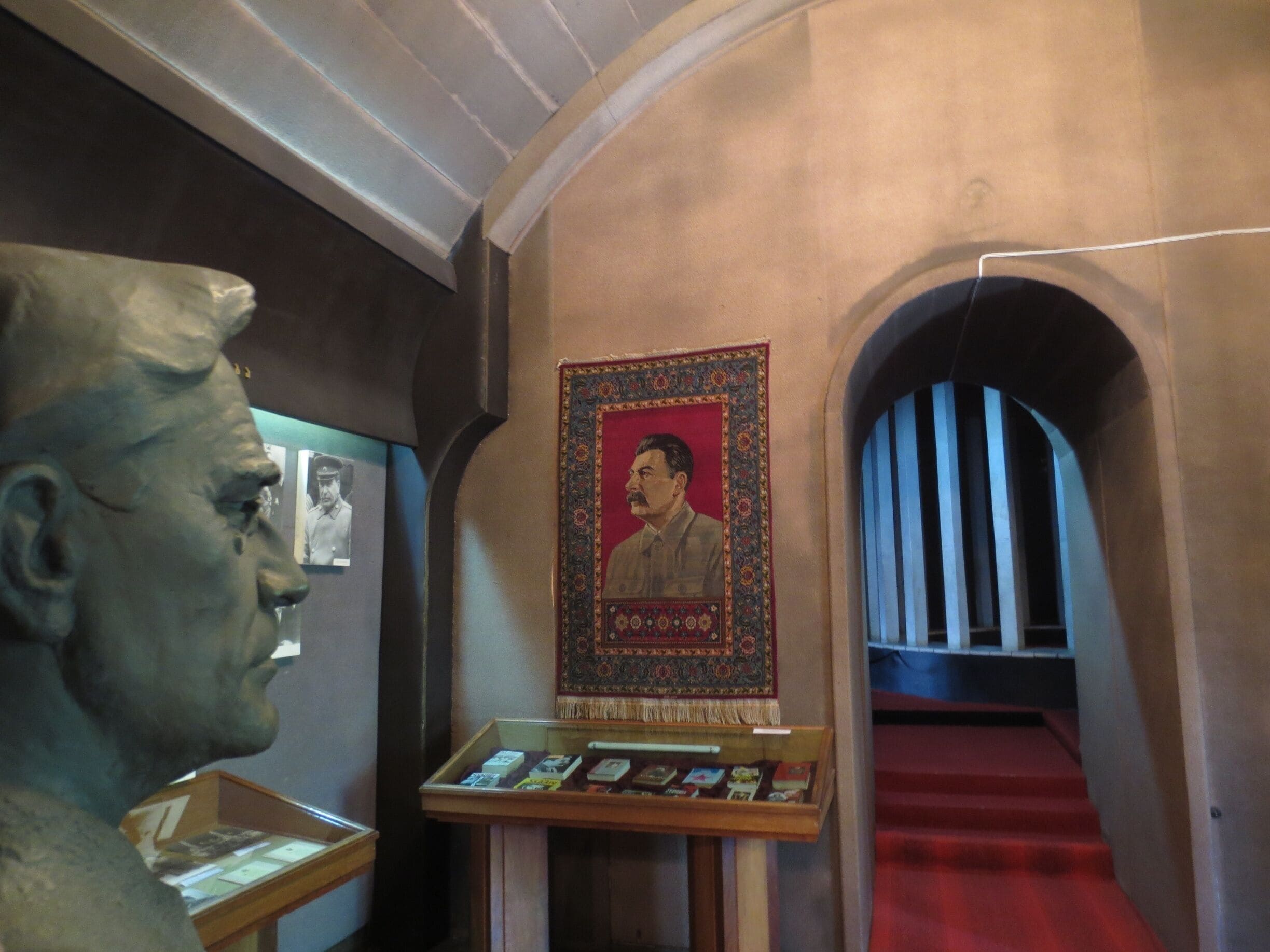 Bust of FDR on the left, image of Stalin woven into a ceremonial rug in the background.

View from the Joseph Stalin Museum in Gori, Georgia. 