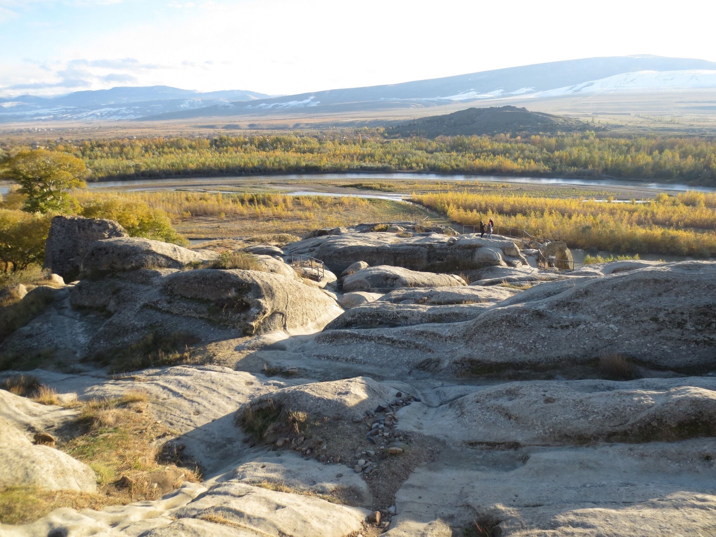 Sunshine on the rocks - view from the Uplistsikhe cave complex near Gori, Georgia.

Uplistsikhe is an ancient fortress settlement that sits up on a hill in a river valley.  For a small fee you can climb up a set of stairs and explore what's left on this ancient settlement.

It features an excellent view of the surrounding area.  