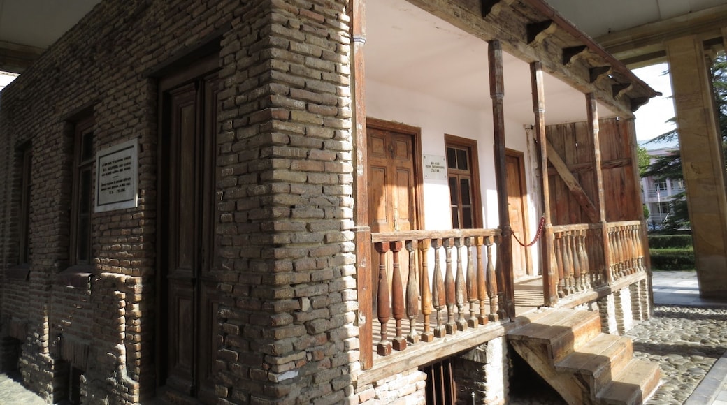 #architecture Joseph Stalin's boyhood home. View from the Joseph Stalin Museum in the city of Gori, Georgia.
Joseph Stalin, former leader of the USSR, was born in raised in a small town called Gori, Georgia.
The picture here is of his the small home where he spent his formative years. Although the rest of that neighborhood was demolished, his home was saved, and entombed in a structure to protect it from the elements.
When you visit the museum, you can peek your head and look into the small bedroom where he was raised by his mother Kete and his alcoholic father who once repeatedly beat him so hard he urinated blood for a week.