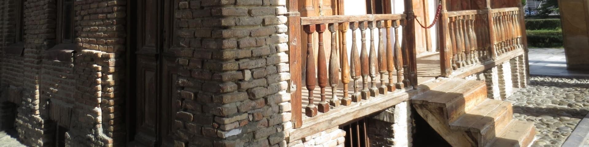 #architecture Joseph Stalin's boyhood home. View from the Joseph Stalin Museum in the city of Gori, Georgia.
Joseph Stalin, former leader of the USSR, was born in raised in a small town called Gori, Georgia.
The picture here is of his the small home where he spent his formative years. Although the rest of that neighborhood was demolished, his home was saved, and entombed in a structure to protect it from the elements.
When you visit the museum, you can peek your head and look into the small bedroom where he was raised by his mother Kete and his alcoholic father who once repeatedly beat him so hard he urinated blood for a week.