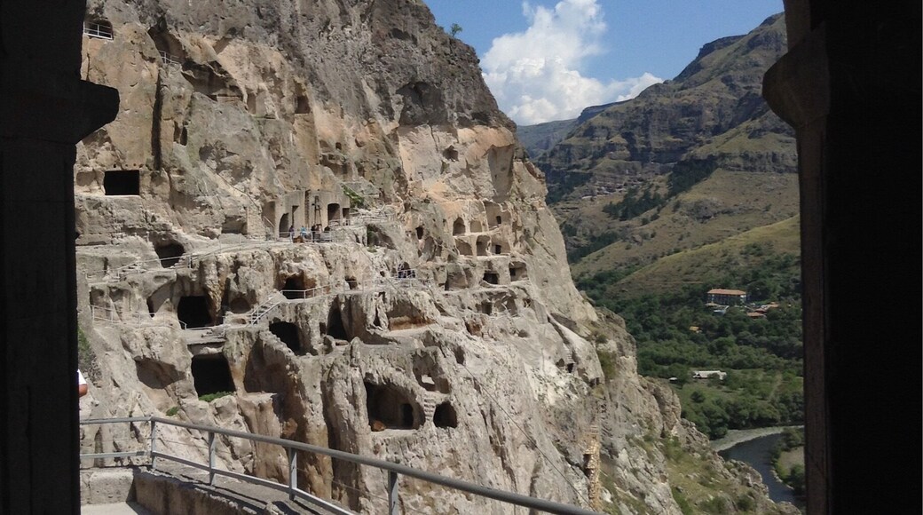 Vardzia is a cave monastery site in southern Georgia. The site, excavated from the Erusheti Mountain, dates to the 12th century. Absolutely amazing place, and is worth a visit when in Georgia.
There is a restaurant and hotel next to the river at the base of the mountain.
Journey time from Akhaltsikhe is 1 hour by car.
http://www.greengoulash.com/vardzia/